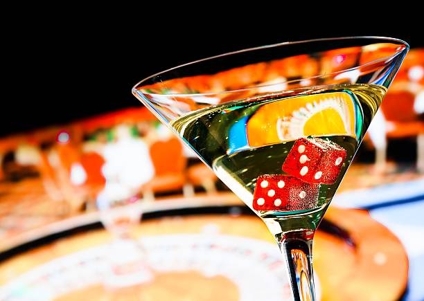 Live dealer at foto slot blackjack table with cards and betting chips